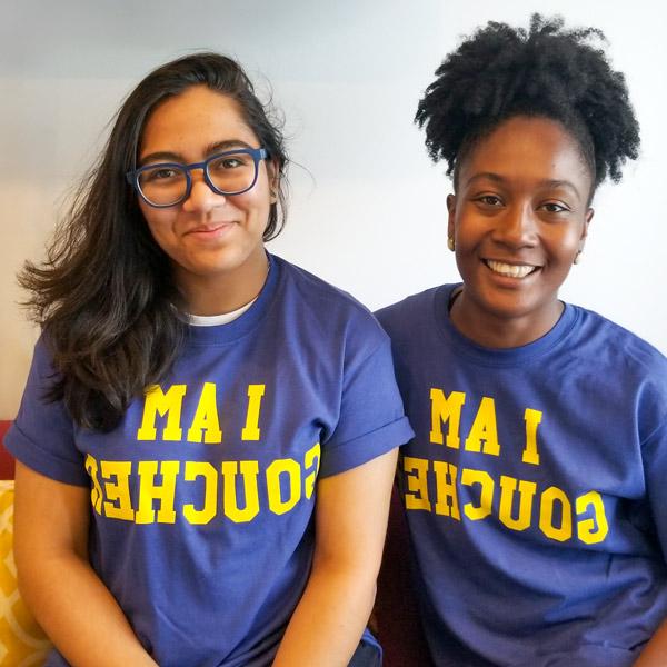 2 goucher students wearing Goucher T-shirts